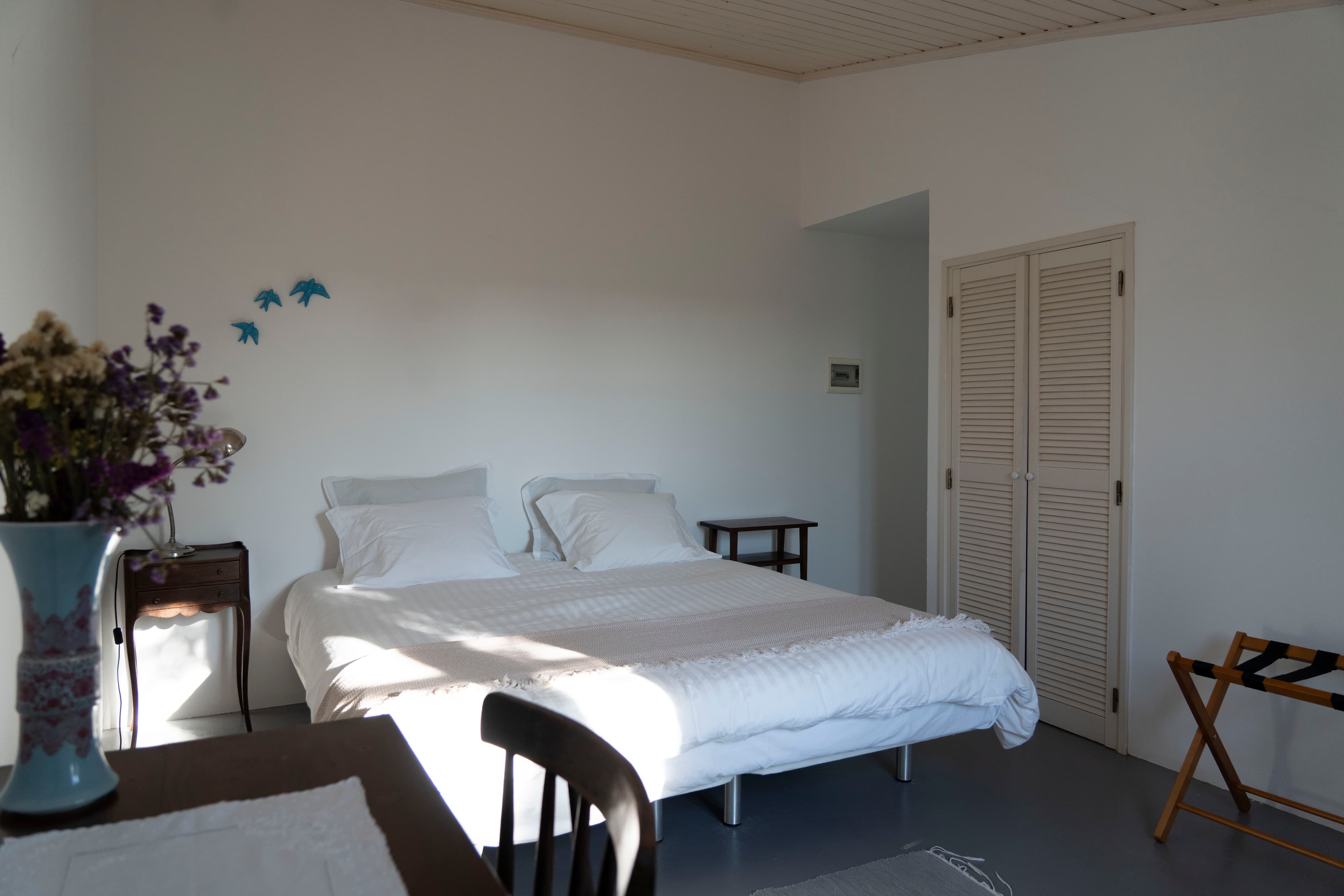 Bedroom with painted swallow detail