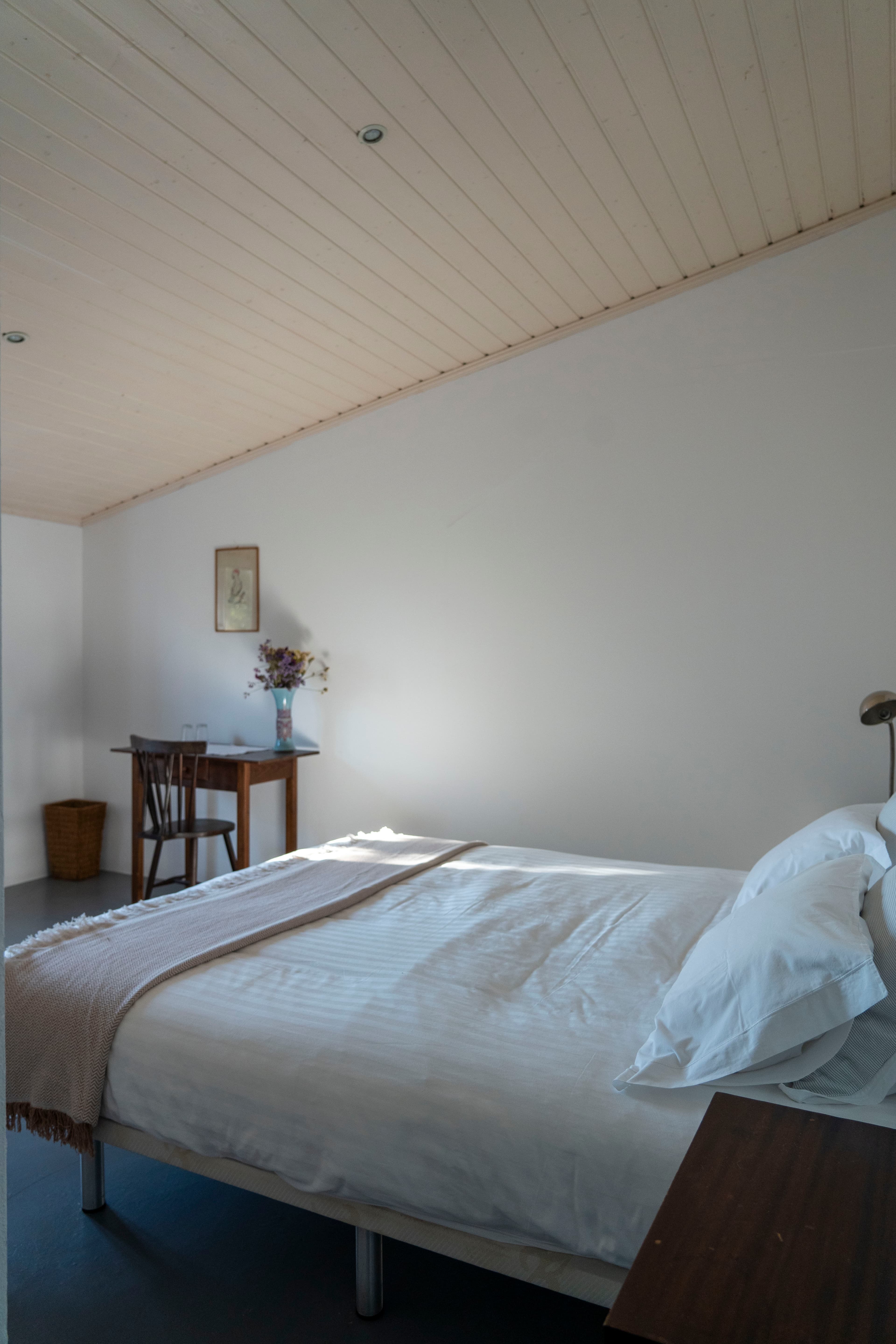 Bedroom with pine ceiling