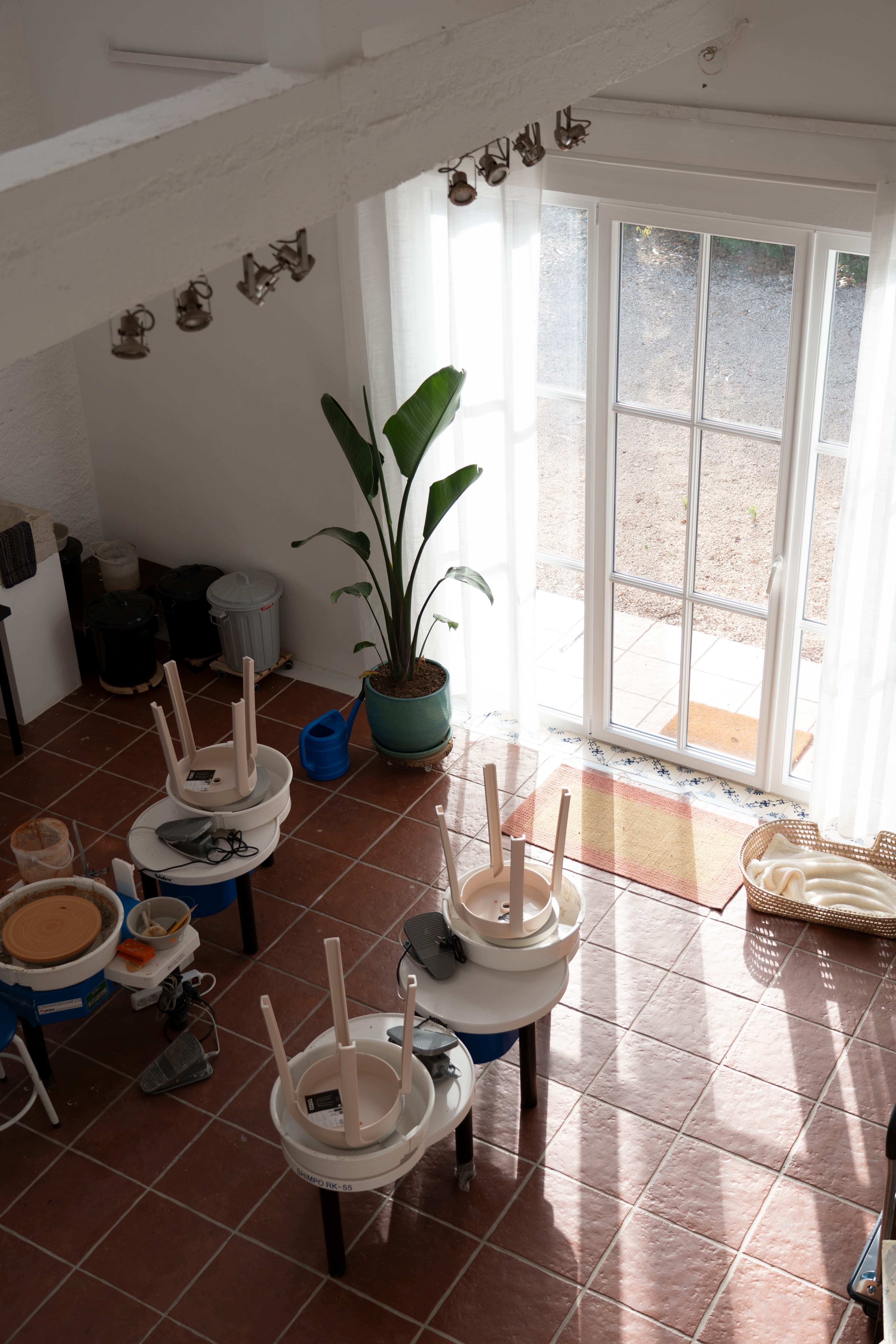 Pottery studio with wheels and natural light