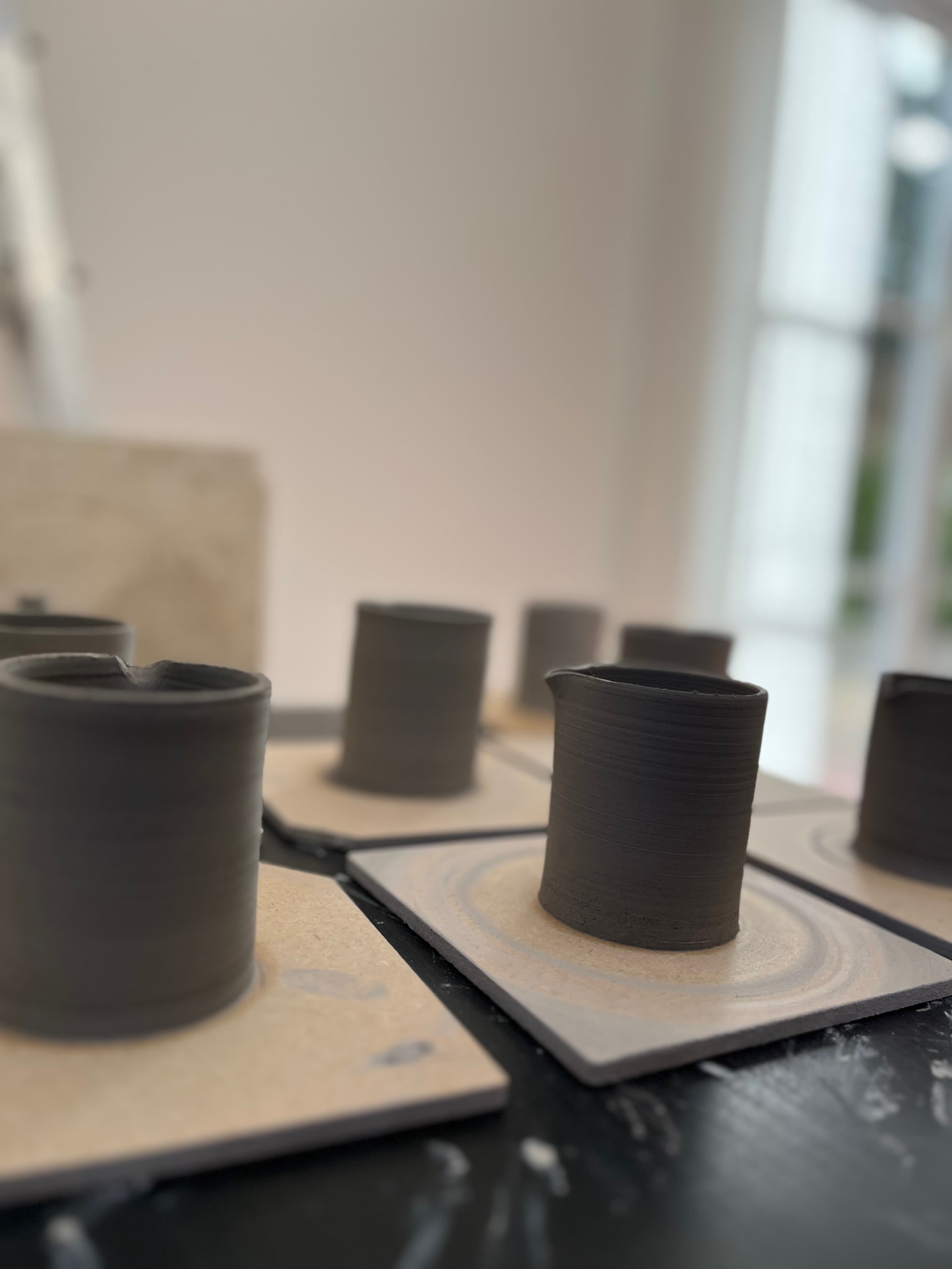 Freshly thrown cups drying