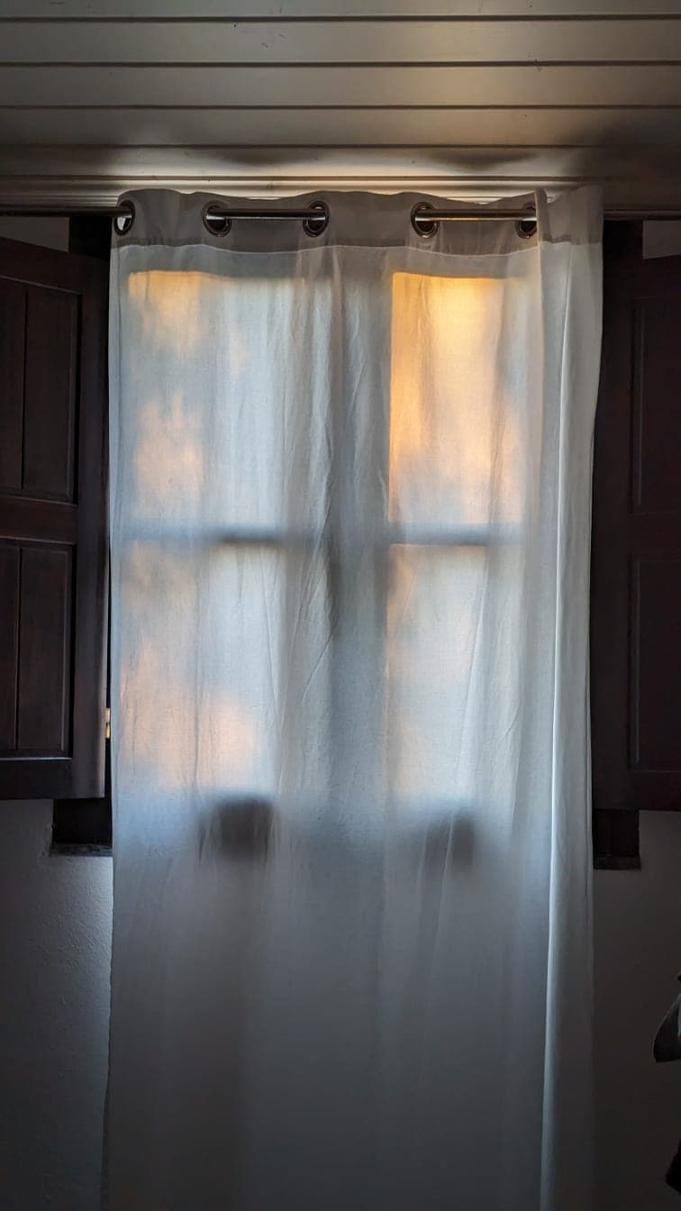 Linen curtains catching afternoon light